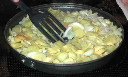 Cook the potatoes and onion slowly on medium heat.